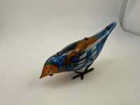 mechanisches Blechspielzeug pickender Vogel