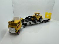 Peterbilt Tieflader + Bagger