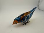 mechanisches Blechspielzeug pickender Vogel